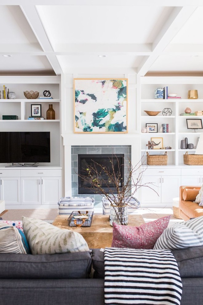 This is an example of a medium sized nautical open plan living room in Salt Lake City with white walls, light hardwood flooring, a standard fireplace and a built-in media unit.