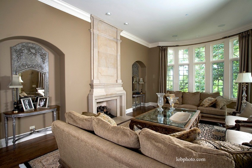 Photo of a large traditional formal enclosed living room in Chicago with medium hardwood flooring, a standard fireplace and a stone fireplace surround.