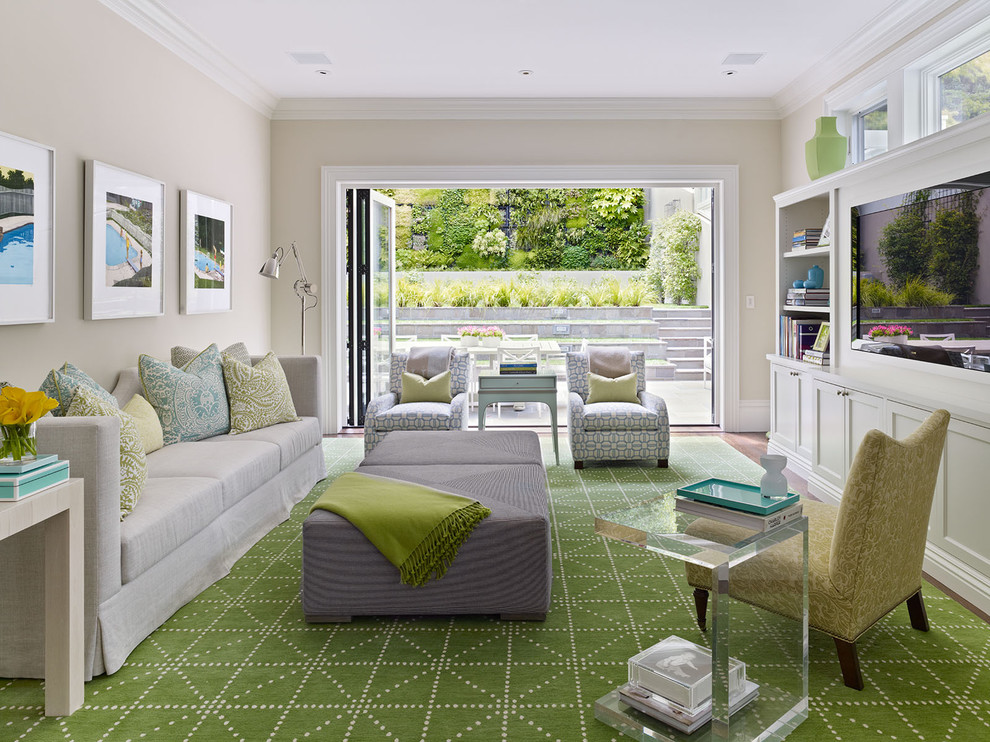 Living room - large transitional living room idea in San Francisco with beige walls and a media wall