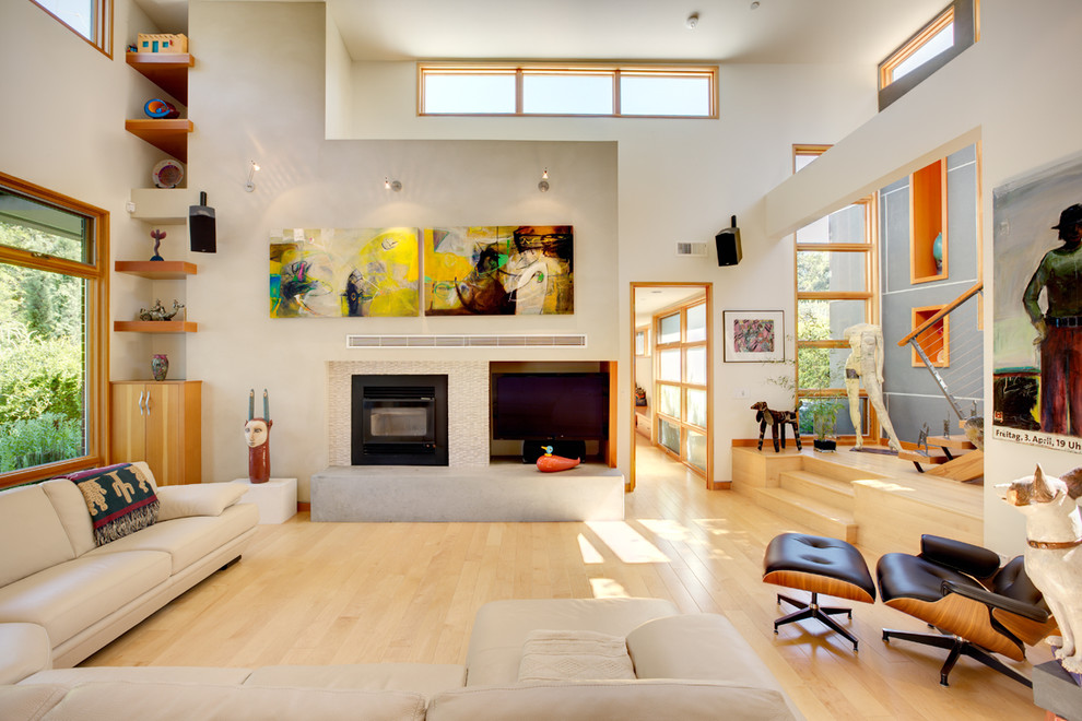 Example of a minimalist open concept living room design in Sacramento with white walls