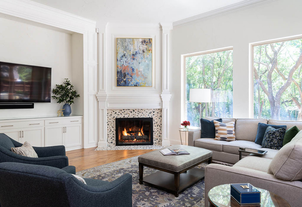 Inspiration for a small classic living room in Dallas with white walls, medium hardwood flooring, a corner fireplace, a wall mounted tv and brown floors.
