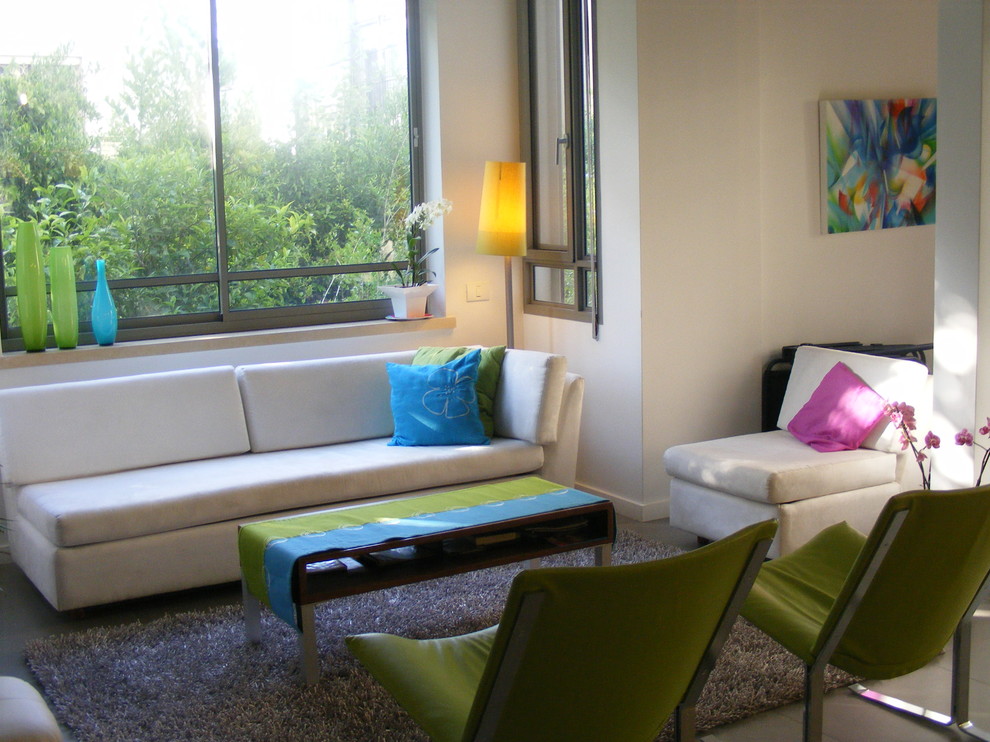 Bohemian living room in Tel Aviv with white walls.