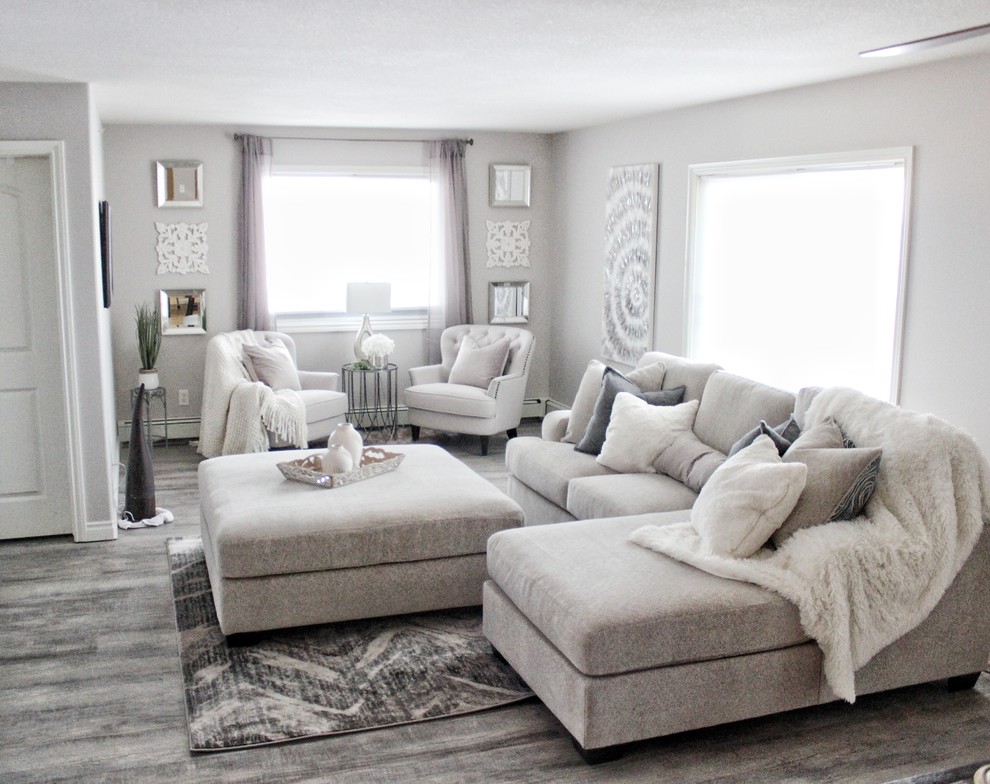 Immagine di un soggiorno design con pareti grigie