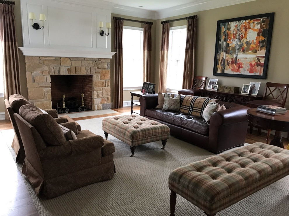 Photo of a large classic living room in Philadelphia with beige walls, medium hardwood flooring, a standard fireplace, a stone fireplace surround, no tv and brown floors.