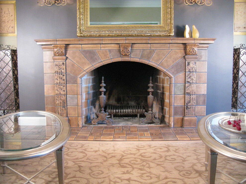 Large traditional formal enclosed living room in Portland with a tiled fireplace surround, grey walls, light hardwood flooring and a standard fireplace.
