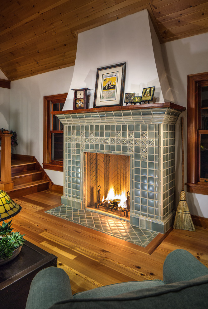 Inspiration for a large craftsman open concept medium tone wood floor living room remodel in Detroit with white walls, a standard fireplace and a tile fireplace