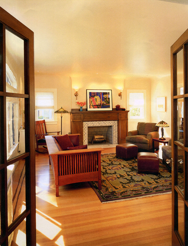 Arts and crafts living room photo in Seattle with a tile fireplace