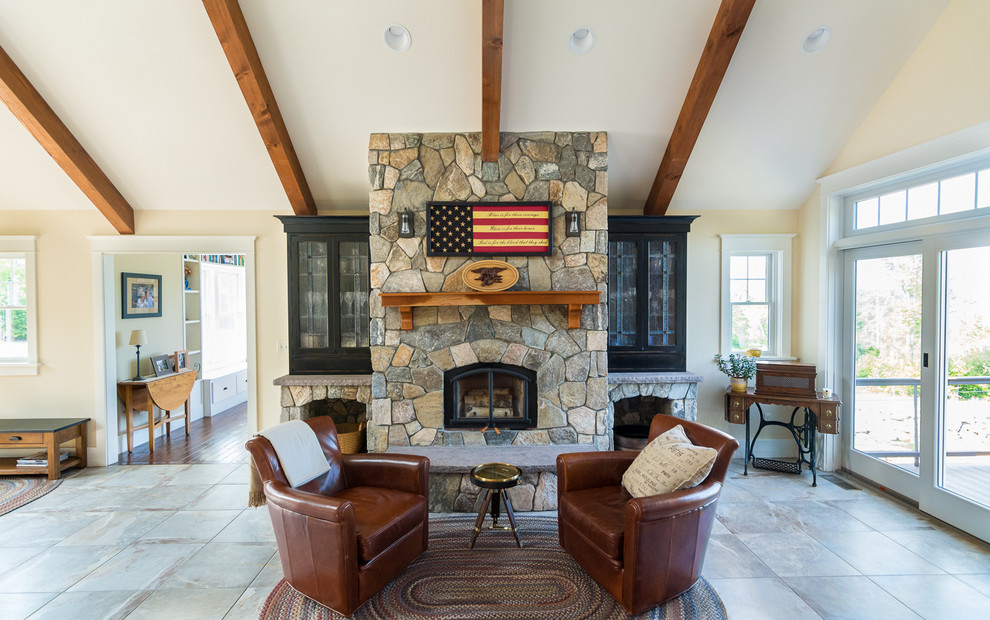 Living room - mid-sized craftsman open concept slate floor and brown floor living room idea in Portland Maine with beige walls, a standard fireplace and a stone fireplace