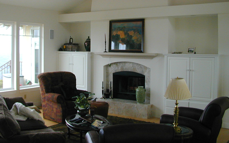 Medium sized traditional formal enclosed living room in San Luis Obispo with white walls, light hardwood flooring, a standard fireplace, a stone fireplace surround, no tv and beige floors.