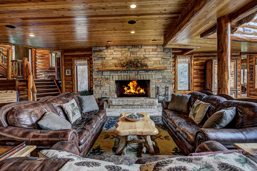Mountain style formal and open concept living room photo in Other with brown walls, a ribbon fireplace, a stone fireplace and no tv
