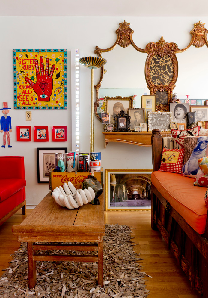 Mid-sized eclectic formal and open concept medium tone wood floor and brown floor living room photo in New York with white walls, no fireplace and no tv