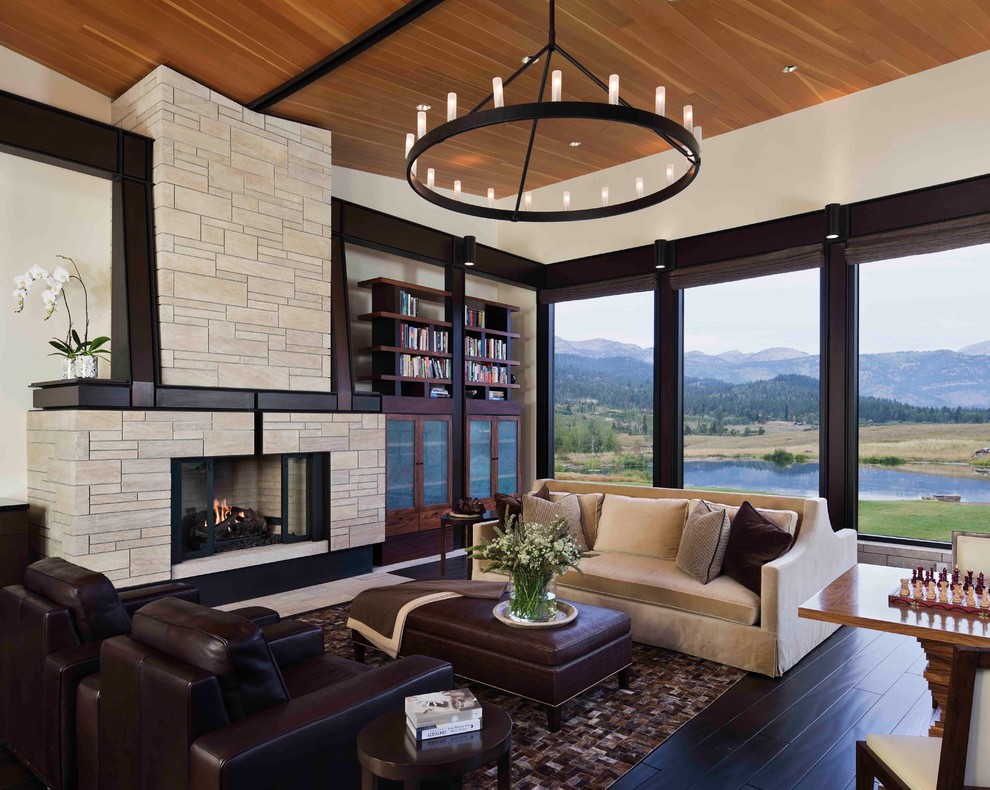 Example of a mid-sized trendy formal and open concept dark wood floor and brown floor living room design in Other with a stone fireplace, white walls, a standard fireplace and no tv