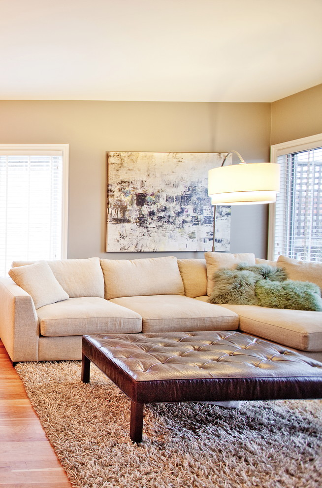 Living room - contemporary open concept medium tone wood floor living room idea in Toronto with gray walls