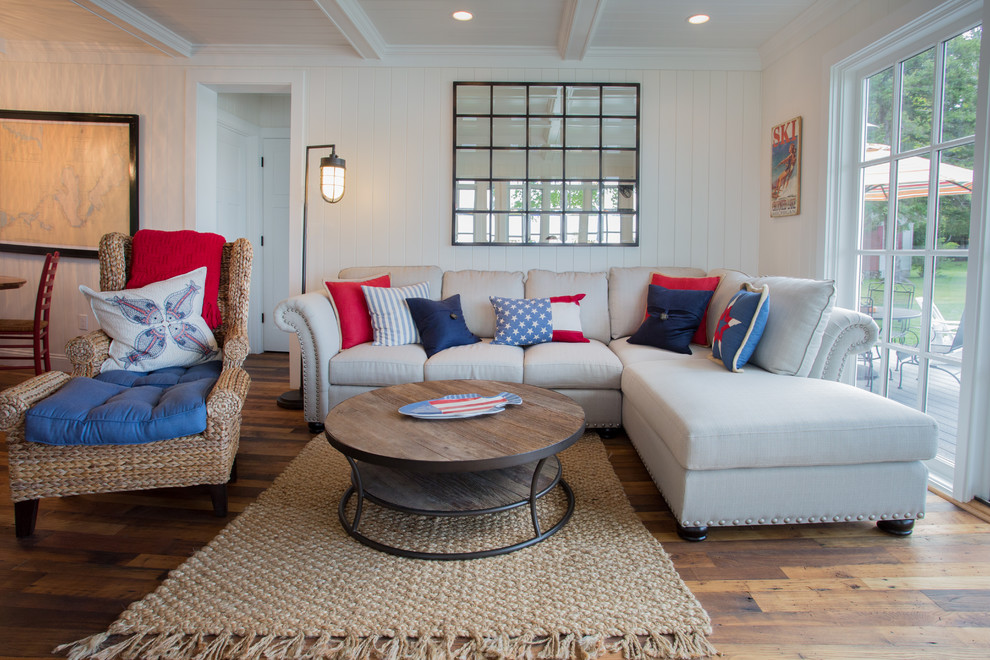 Photo of a large coastal formal open plan living room in Other with white walls, medium hardwood flooring, no fireplace, no tv and brown floors.