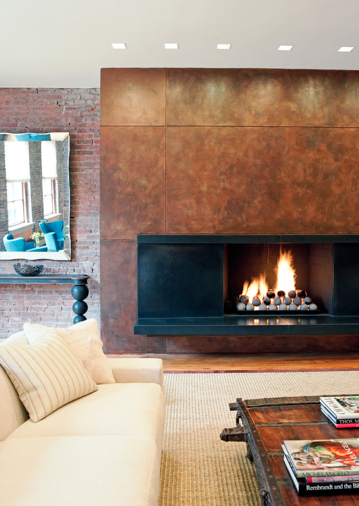 Design ideas for a contemporary living room in New York with a standard fireplace and a concrete fireplace surround.