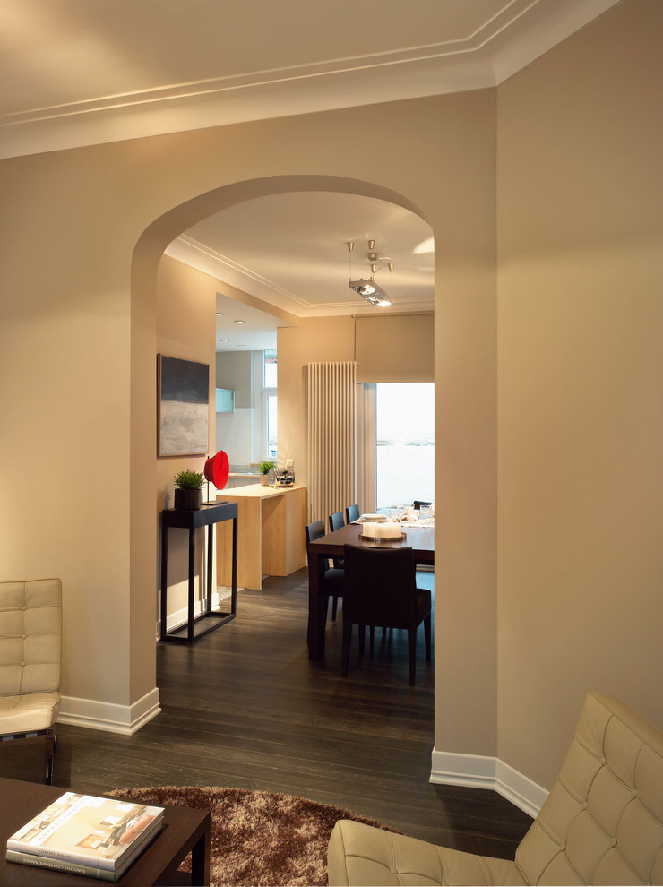 Example of a mid-sized trendy open concept dark wood floor living room design in Miami with beige walls