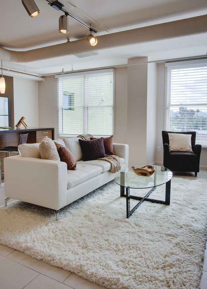 Photo of a small contemporary open plan living room in Phoenix with beige walls and porcelain flooring.