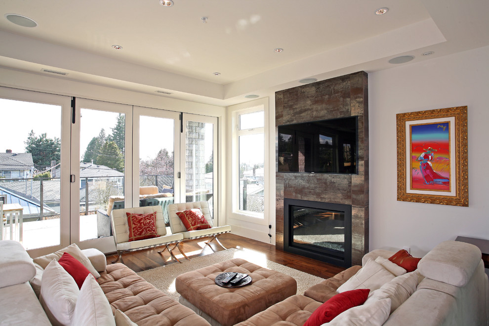 Contemporary living room in Vancouver with a wall mounted tv.