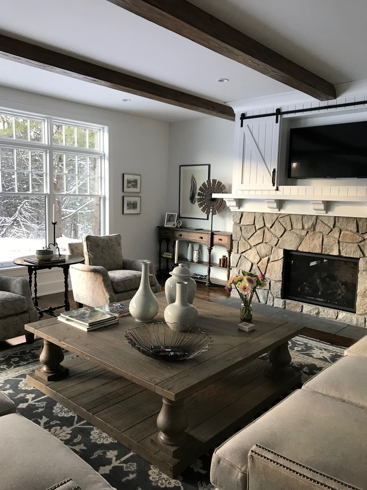 Mid-sized country formal and open concept dark wood floor and brown floor living room photo in New York with white walls, a standard fireplace, a stone fireplace and a concealed tv
