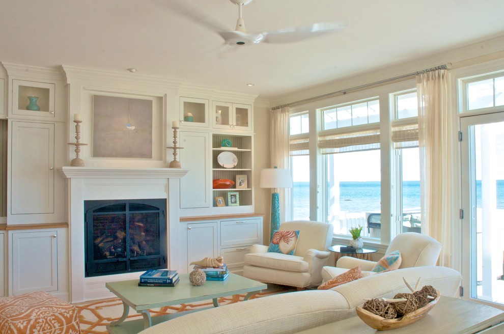 Imagen de salón para visitas abierto costero grande sin televisor con paredes blancas, moqueta, todas las chimeneas y marco de chimenea de madera