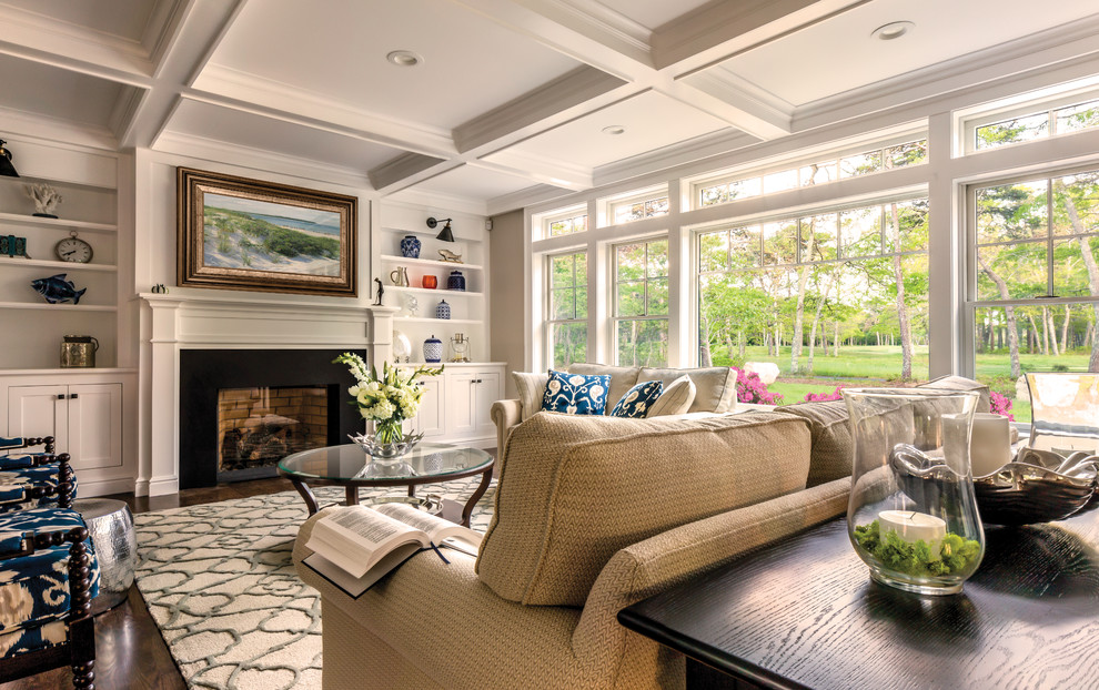 This is an example of a large classic formal open plan living room in Boston with white walls, dark hardwood flooring, a standard fireplace and a stone fireplace surround.