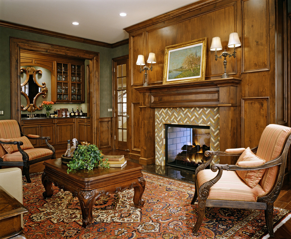 На фото: изолированная гостиная комната среднего размера в классическом стиле с домашним баром, зелеными стенами, двусторонним камином и фасадом камина из плитки без телевизора с