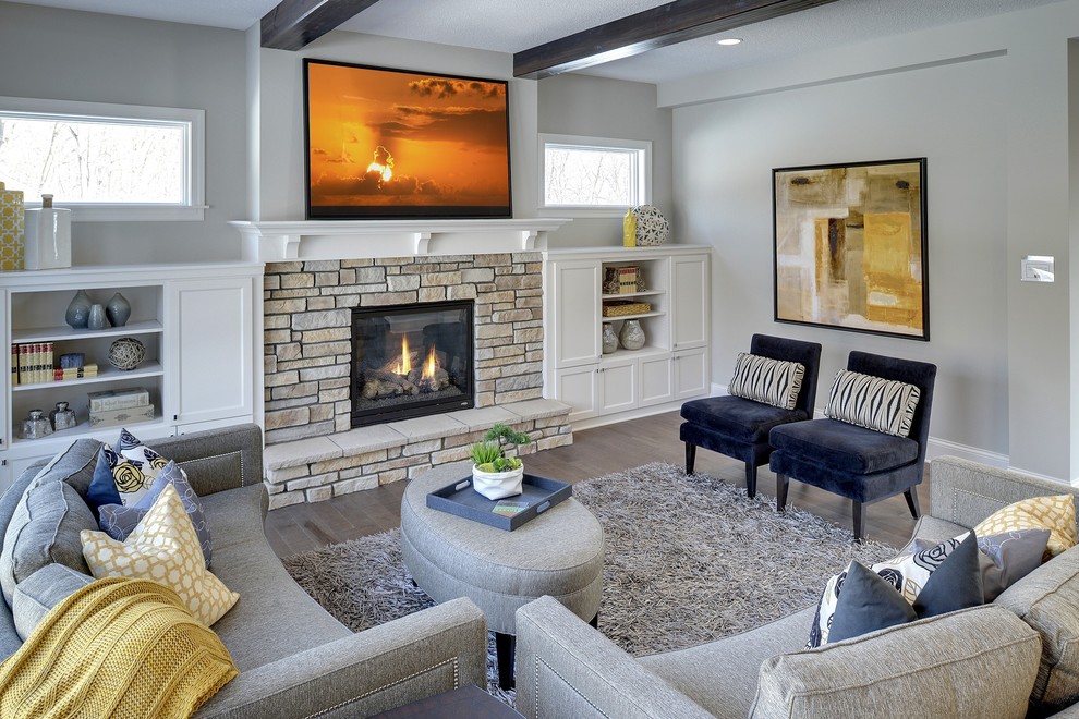 Design ideas for a traditional living room in Minneapolis with grey walls, a standard fireplace and a stone fireplace surround.