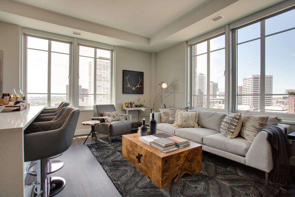 Traditional living room in Minneapolis with grey walls, dark hardwood flooring and brown floors.