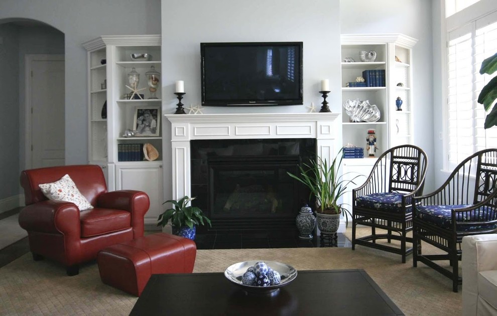 Photo of a medium sized nautical enclosed living room in Salt Lake City with grey walls, dark hardwood flooring, a standard fireplace, a wall mounted tv and beige floors.