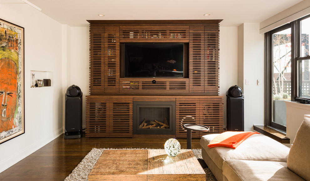 This is an example of a contemporary living room in New York with a built-in media unit.