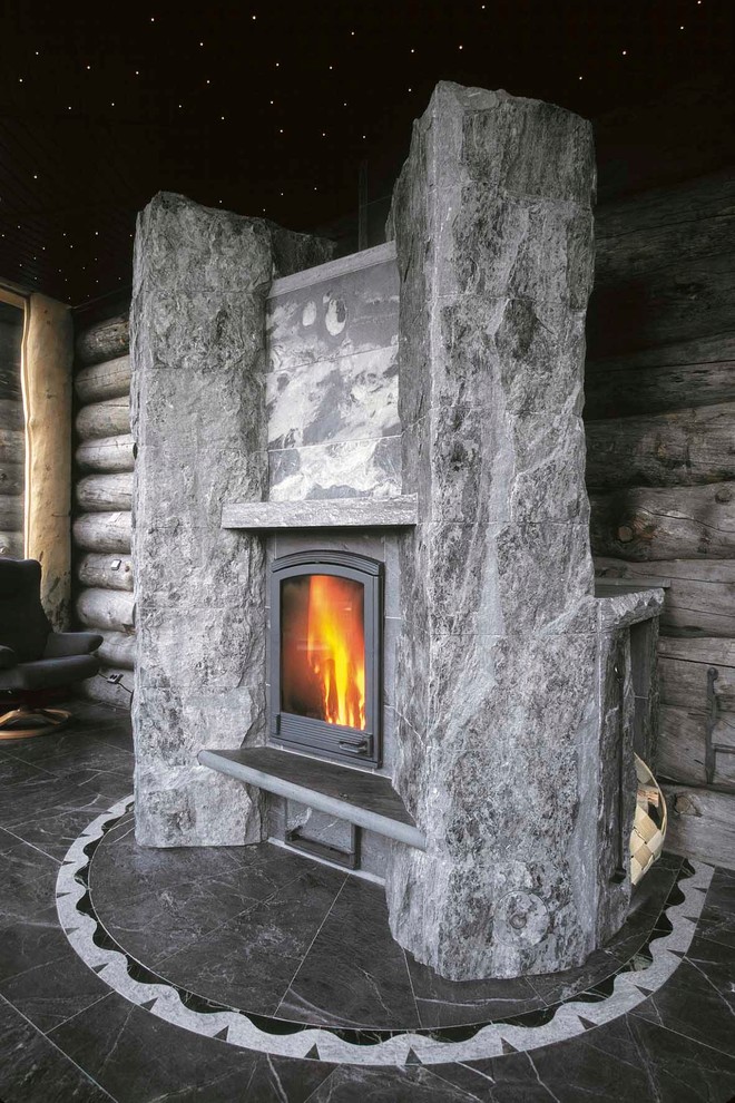 Идея дизайна: изолированная гостиная комната среднего размера в стиле рустика с мраморным полом, стандартным камином, фасадом камина из камня и серым полом без телевизора