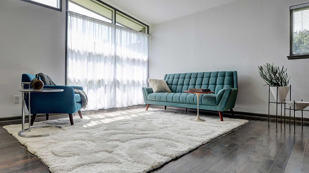 This is an example of a medium sized midcentury formal and grey and teal open plan living room in San Diego with white walls, dark hardwood flooring, no fireplace and no tv.