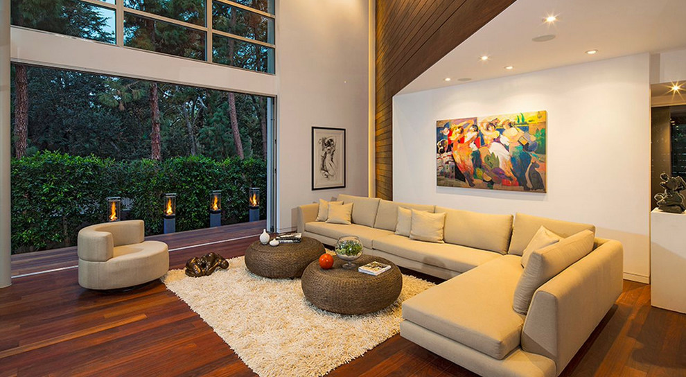 Inspiration for a contemporary open plan living room in Los Angeles with white walls.
