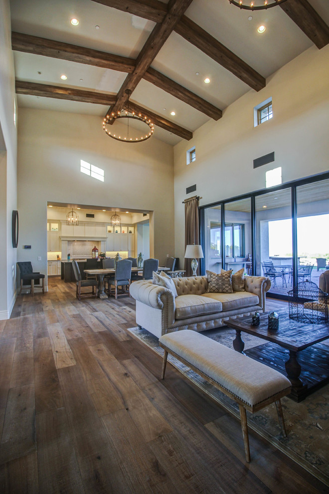 Mid-sized southwest formal and open concept medium tone wood floor living room photo in Phoenix with beige walls, a standard fireplace, a stone fireplace and no tv