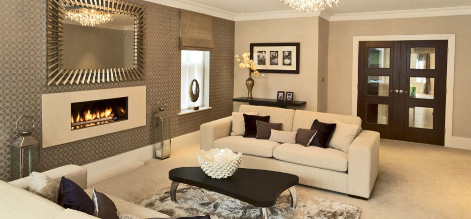 This is an example of a medium sized classic formal open plan living room in Los Angeles with beige walls, terracotta flooring, a standard fireplace, a tiled fireplace surround and a wall mounted tv.