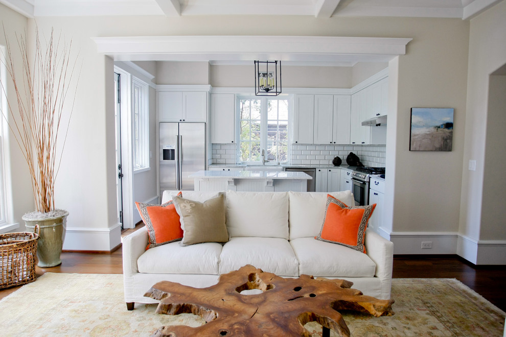 Example of a classic living room design in Charleston with beige walls
