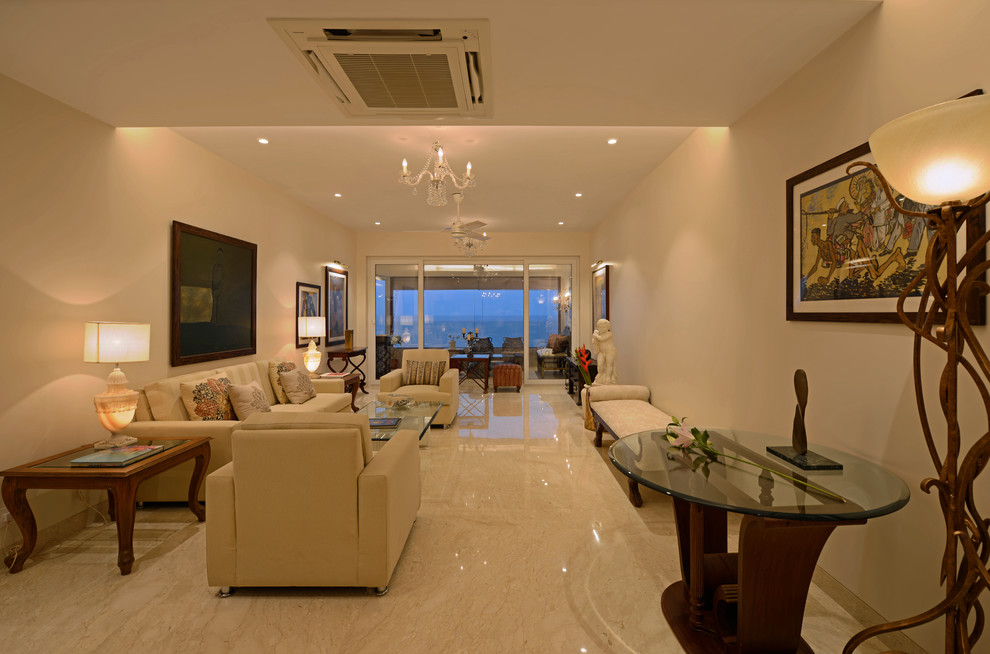 This is an example of a contemporary living room in Mumbai with feature lighting.