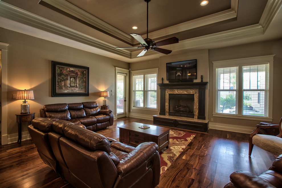 Living room - large craftsman enclosed dark wood floor living room idea in Atlanta with brown walls, a standard fireplace, a tile fireplace and a wall-mounted tv