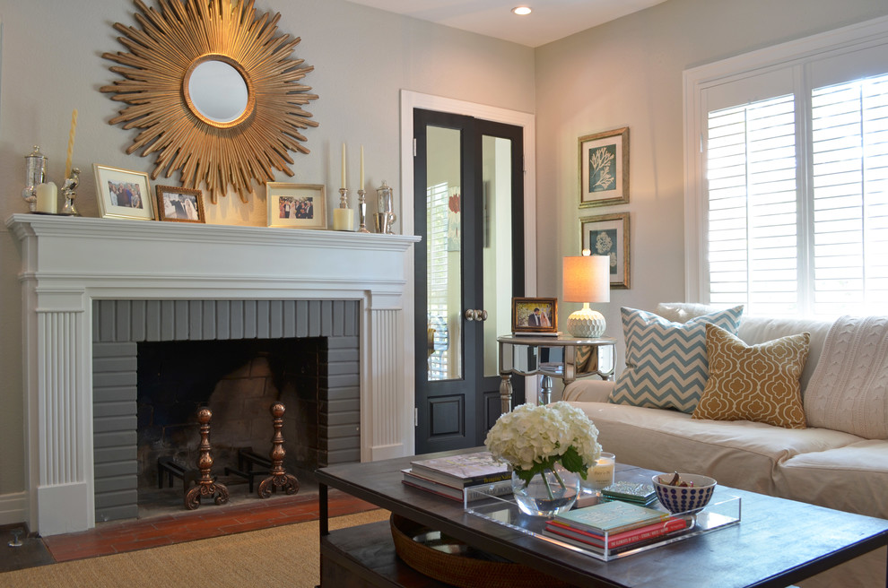 Living room - traditional living room idea in Dallas with gray walls, a standard fireplace and a brick fireplace