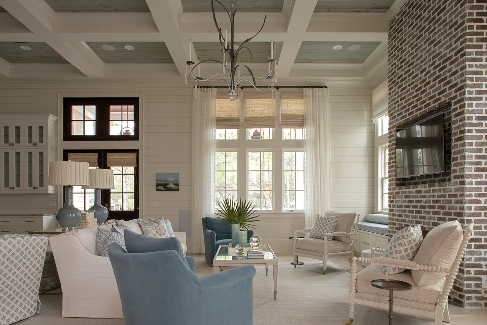 Photo of a nautical formal open plan living room in Other with white walls, a standard fireplace, a brick fireplace surround and a wall mounted tv.