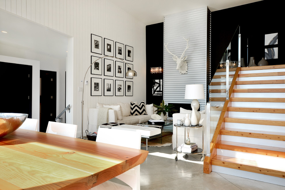 Photo of a contemporary living room feature wall in Vancouver with black walls.