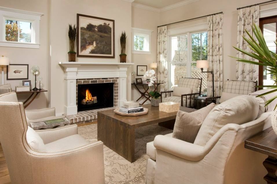 Living room - traditional open concept living room idea in Charleston with a standard fireplace and a brick fireplace