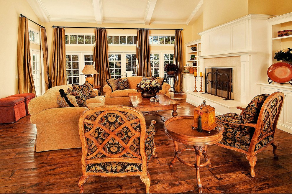 Living room - mid-sized traditional formal and enclosed medium tone wood floor living room idea in Seattle with yellow walls, a standard fireplace, a stone fireplace and no tv