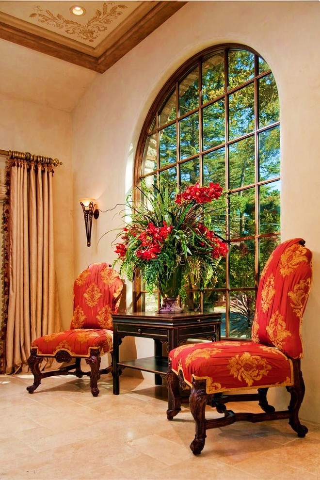 Example of a tuscan limestone floor living room design in Seattle