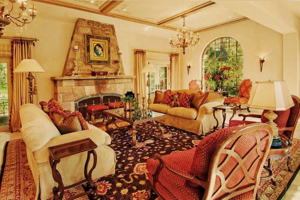 Photo of a mediterranean living room curtain in Seattle with a stone fireplace surround.