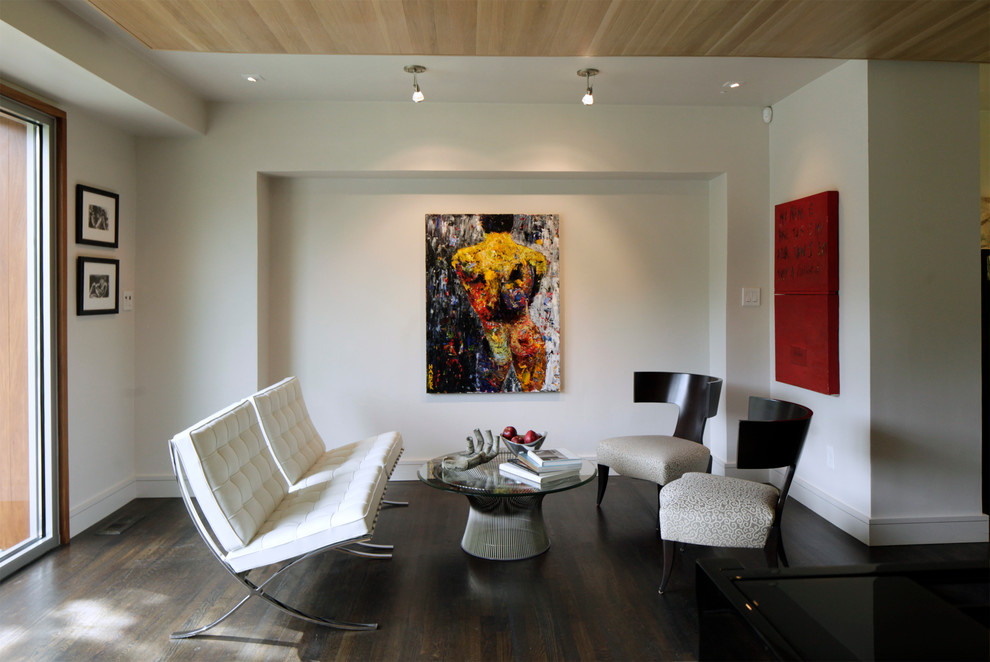 Photo of a small contemporary living room in Atlanta with white walls and dark hardwood flooring.