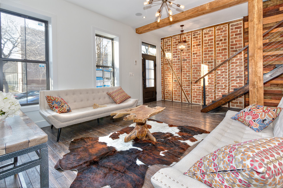 Photo of a medium sized rustic open plan living room in New York with dark hardwood flooring.