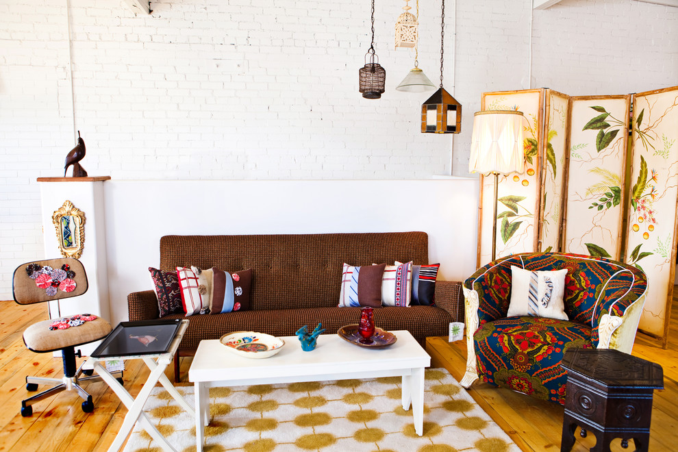 Inspiration for an eclectic living room remodel in Denver with white walls