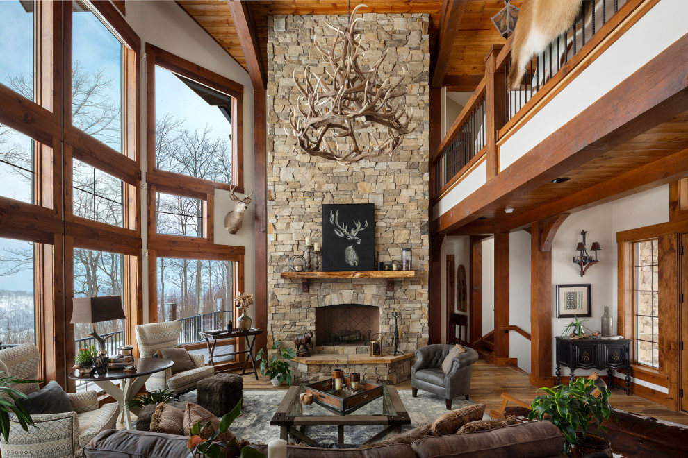 Rustic living room with a stacked stone fireplace surround.