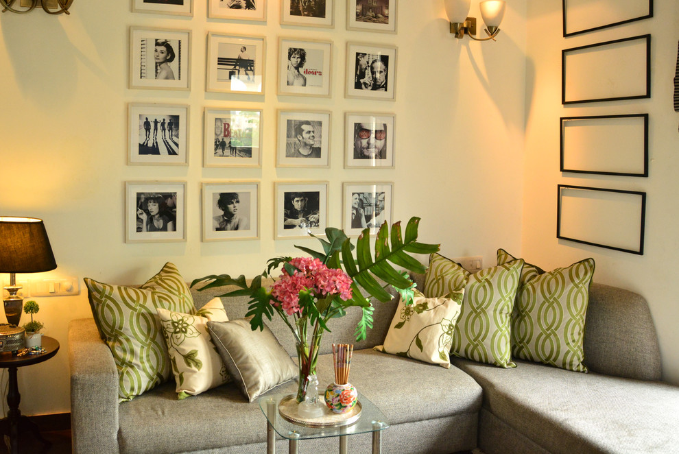 Photo of a contemporary grey and cream living room in Delhi.